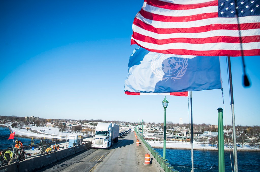 American and UN flags on the Peace Bridge