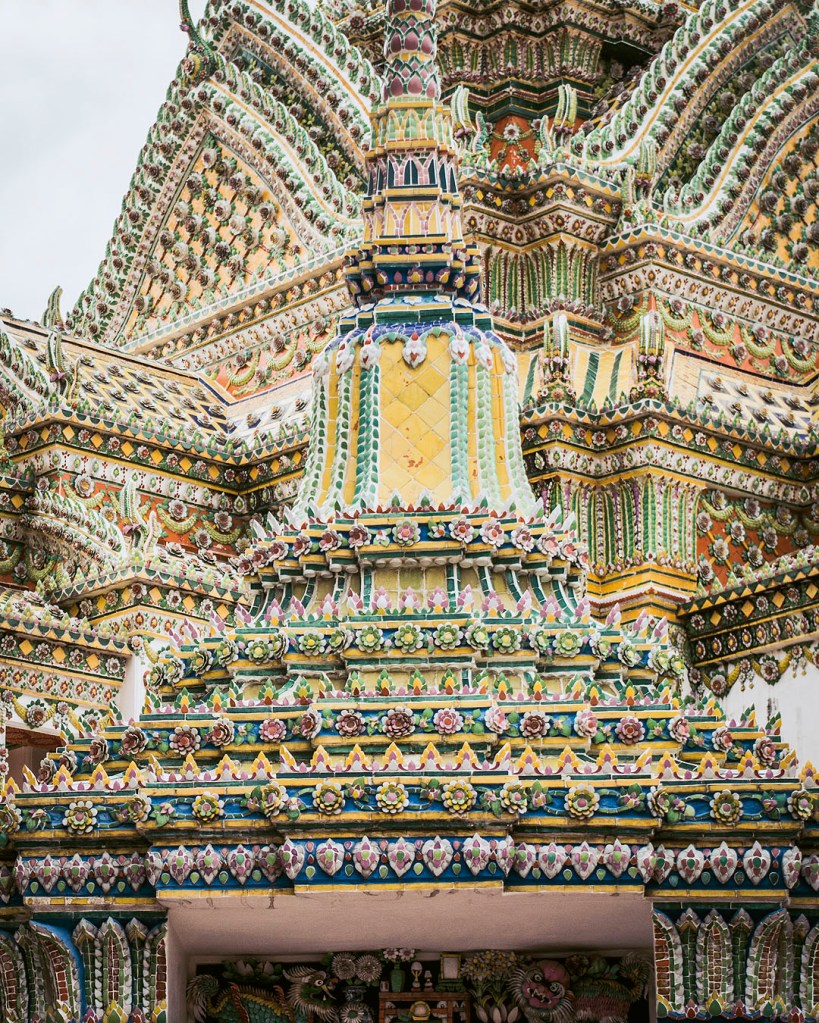 Intricate floral details on a chedi at Wat Pho