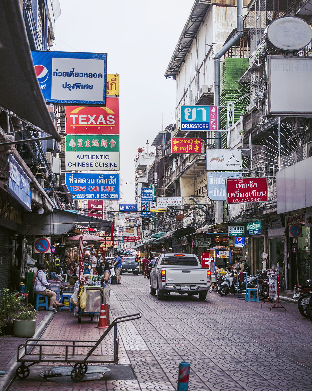 Store signs in an alleyway in Bangkok's Chinatown.