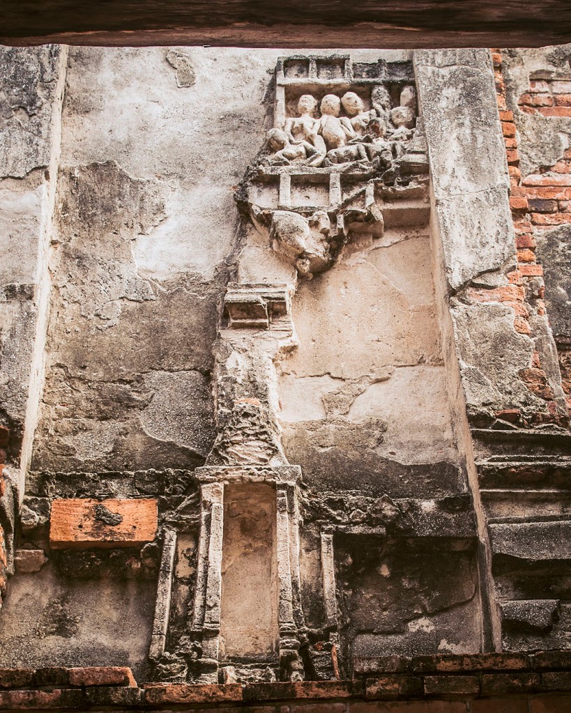Remains of relief sculptures on the walls of Wat Chaiwatthanaram in Ayutthaya, Thailand.