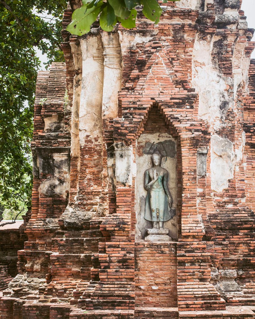 Buddha statue in the ruins at Wat Mahathat in Ayutthaya, Thailand.