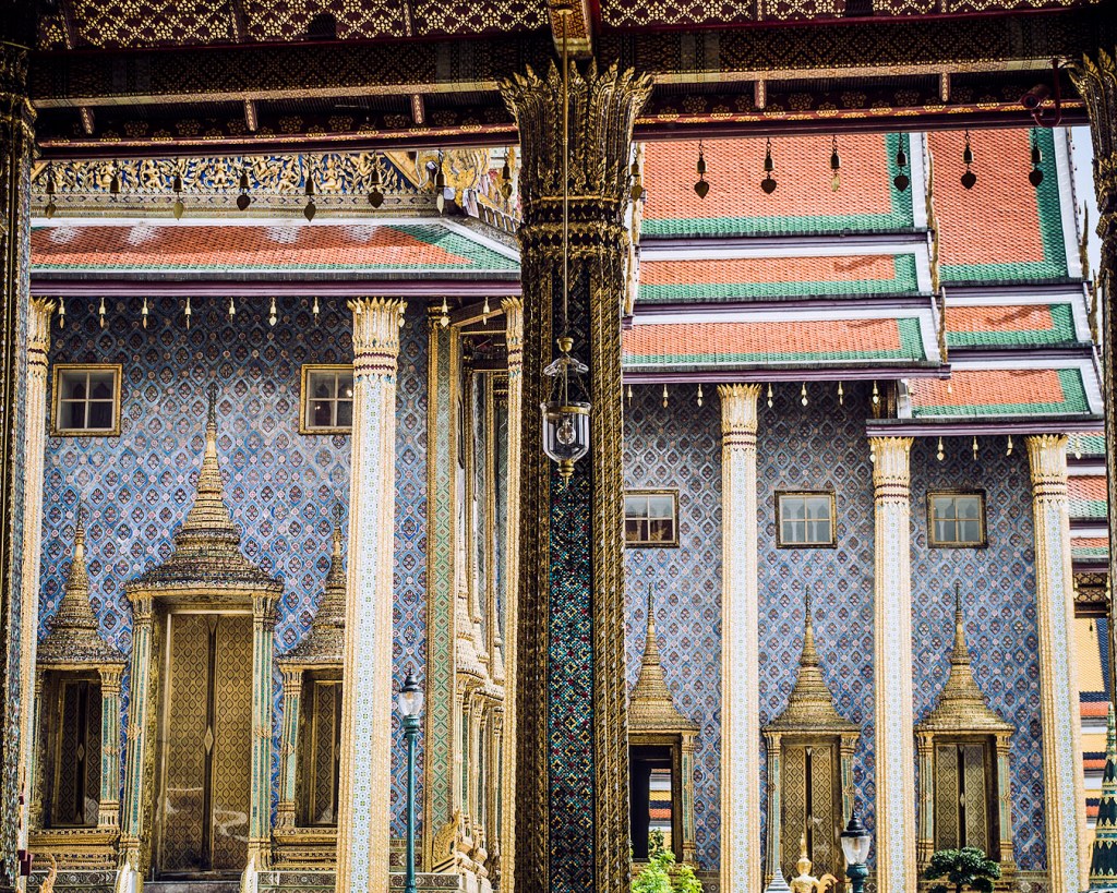 The blue walls of the Prasat Phra Dhepbidorn, the Royal Pantheon, viewed from the Phra Ubosot.