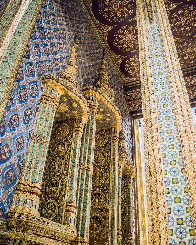 Blue mosaic walls and columns of the Royal Pantheon in the Grand Palace complex in Bangkok, Thailand.