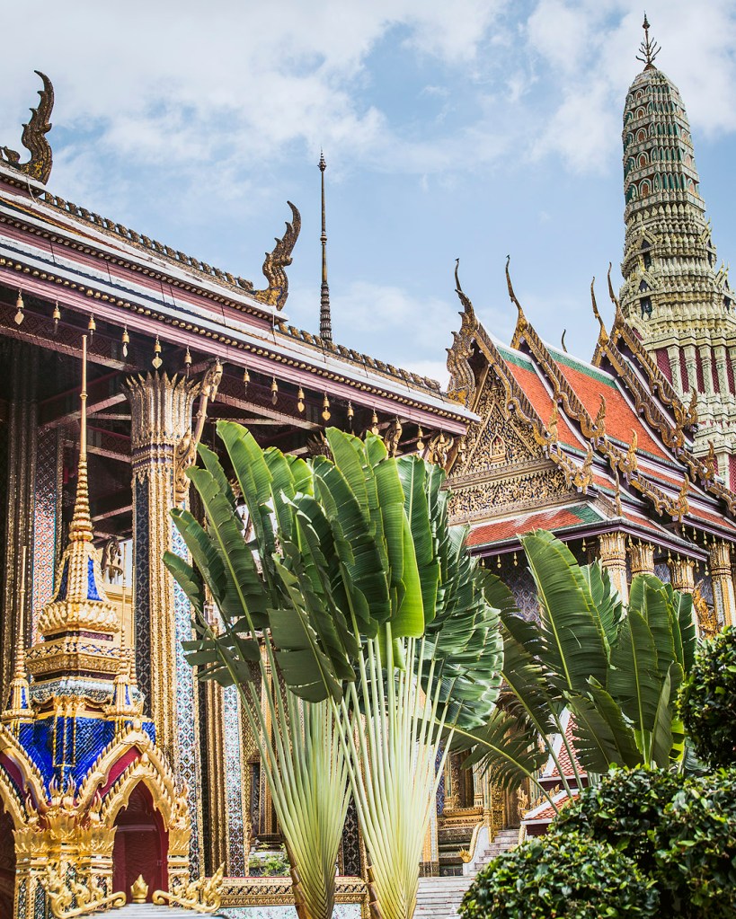 Palms in front of the Chapel of the Emerald Buddha at the Grand Palace in Bangkok, Thailand.