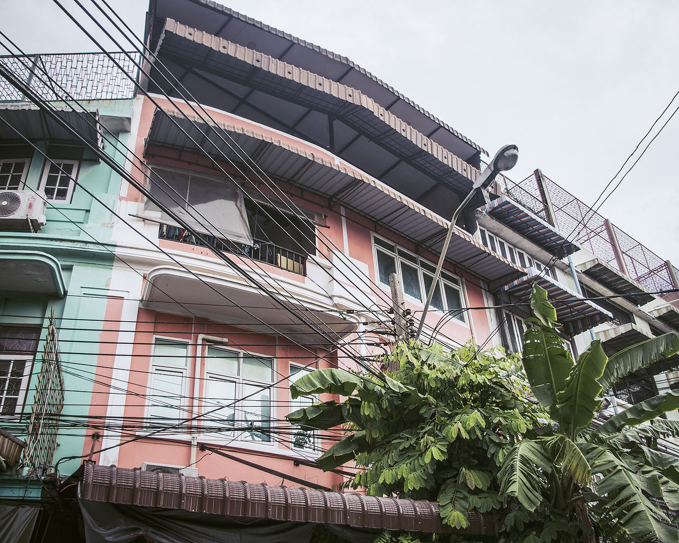 A pink and blue coloured building in Bangkok.