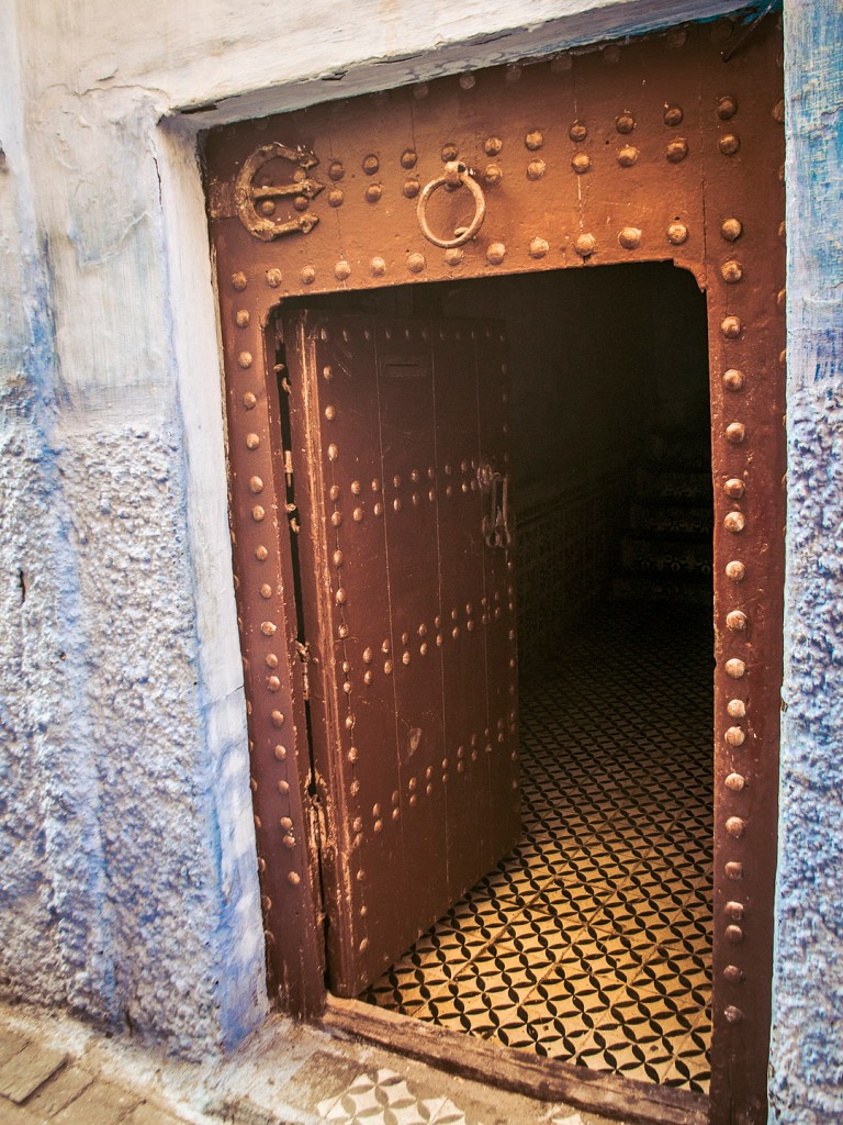 An open door to a blue house in Salé, Morocco.