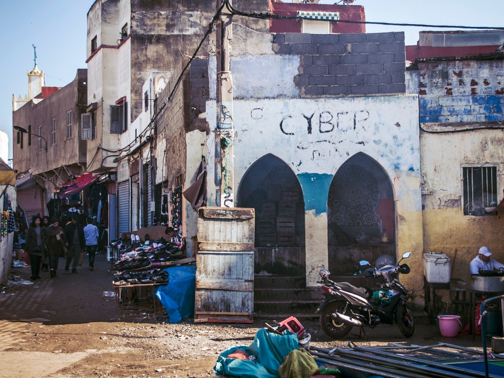 Arches and graffiti in a plaza in the souk in Salé, Morocco.