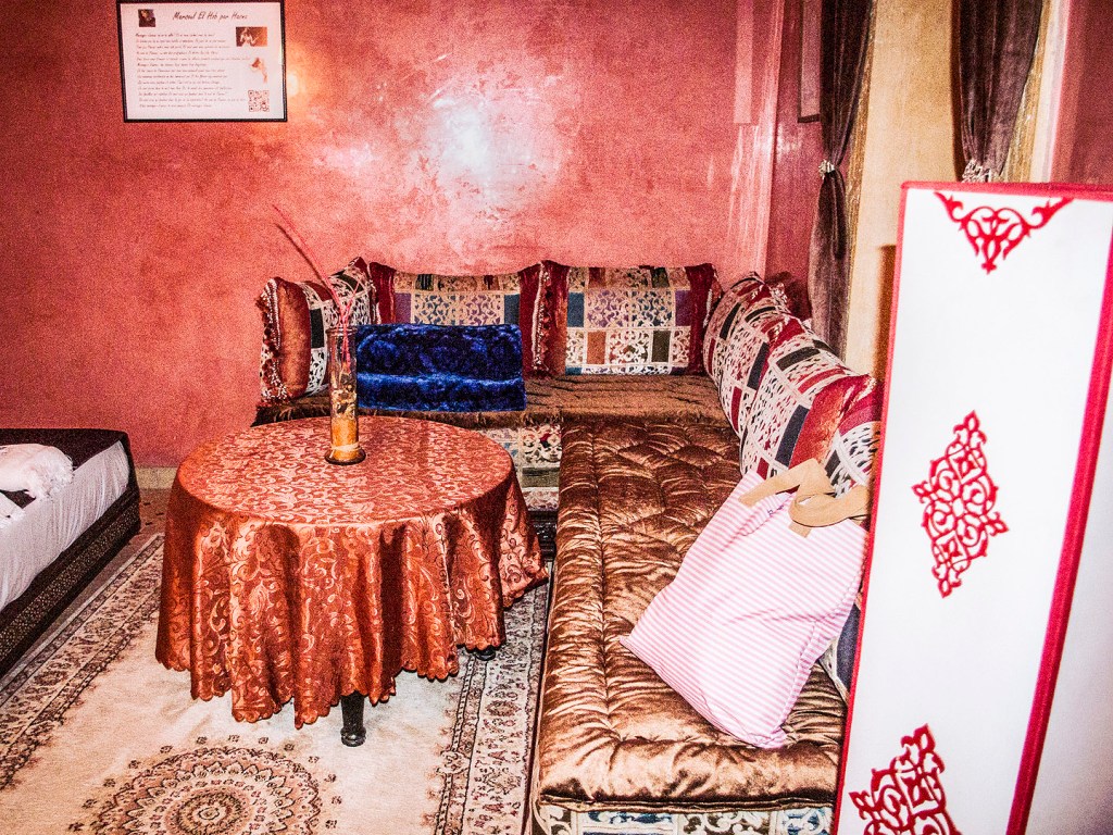 A room with pink walls in a riad in Salé, Morocco.