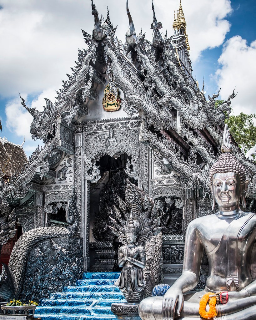 Silver Buddha images outside the silver hall at Wat Sri Suphan.