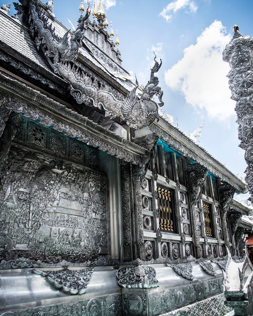 Delicate carvings on the walls of Wat Sri Suphan, the silver temple in Chiang Mai.