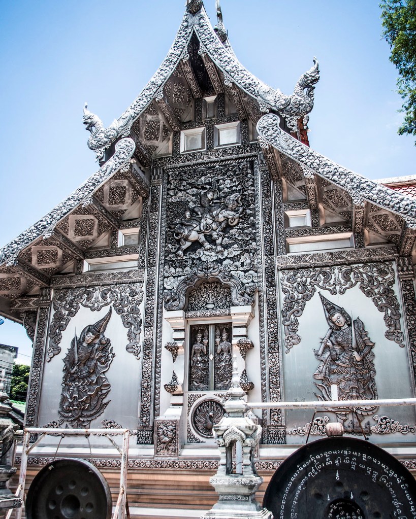 Intricate silver carvings on the back wall of the Suttajitto Gallery at Wat Muen San.