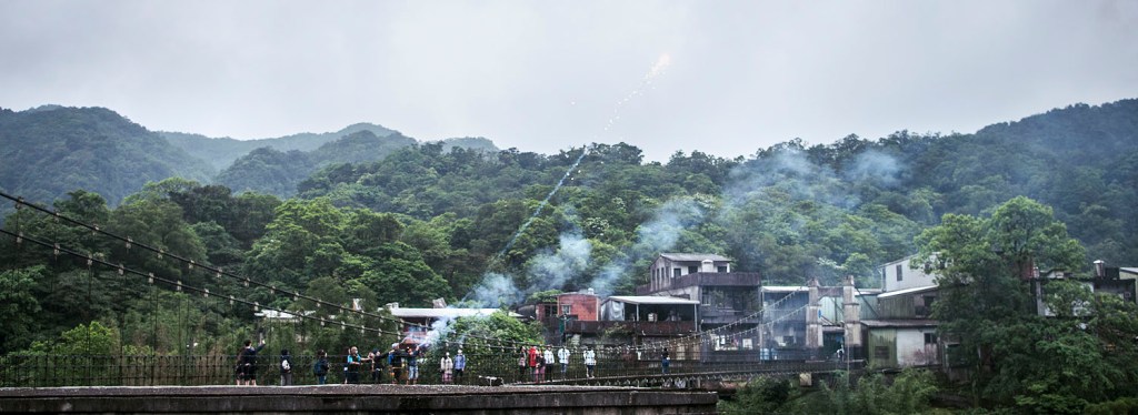 Fireworks being let off on the Jingan Suspension Bridge in Shifen.