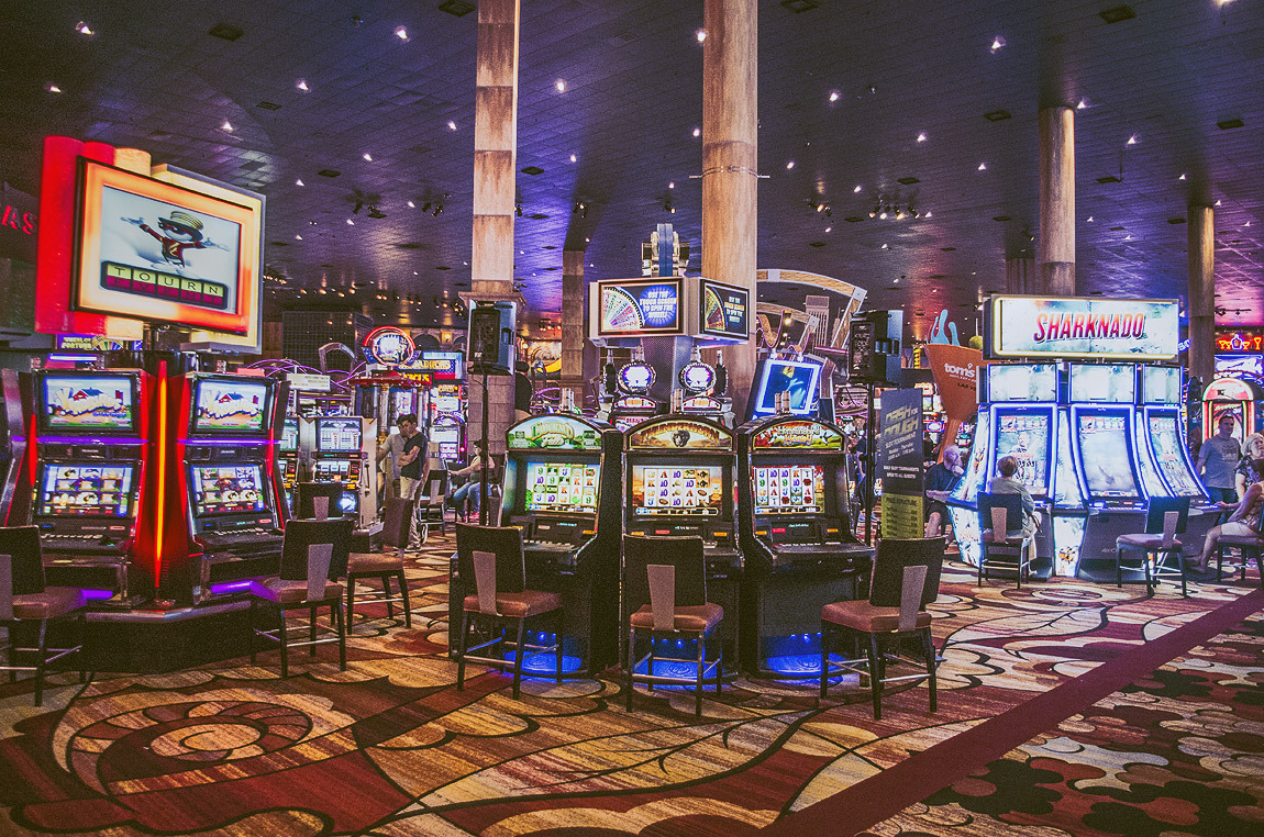 Illuminated slot machines inside a casino in Las Vegas.