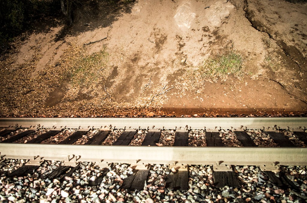 The train tracks at Christie Road, illuminated with an on-camera flash at night.